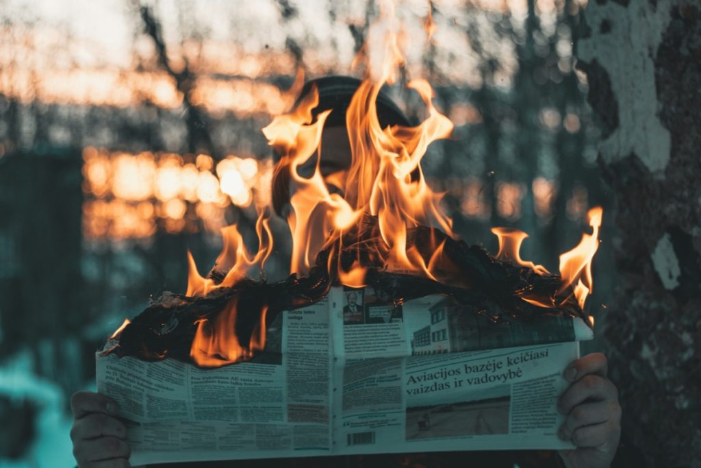 Information Warfare and the Weaponization of Local News by Digital Crime Networks